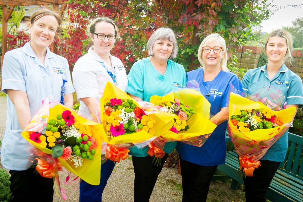 Staff from Eden Valley Hospice receiving their flowers