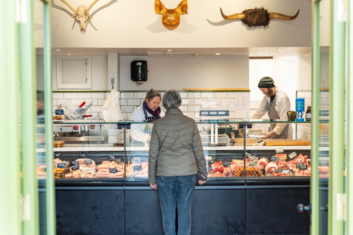 Hayley serving customer at Garside Butchers