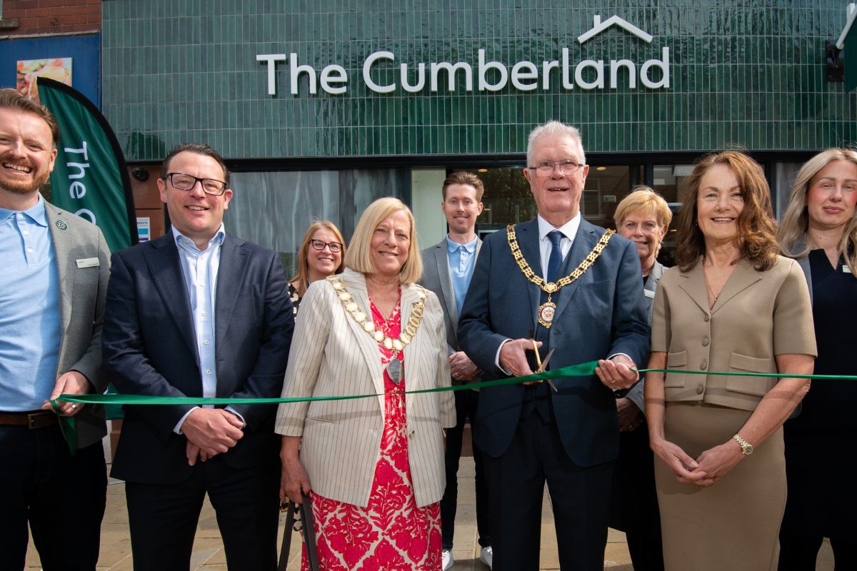 A ribbon-cutting ceremony led by Fred Chatfield, the Mayor of Barrow, with Stuart Miller, The Cumberland’s new Chief Executive, and Jackie Arnold, Chair of its Board, at The Cumberland's Barrow Branch