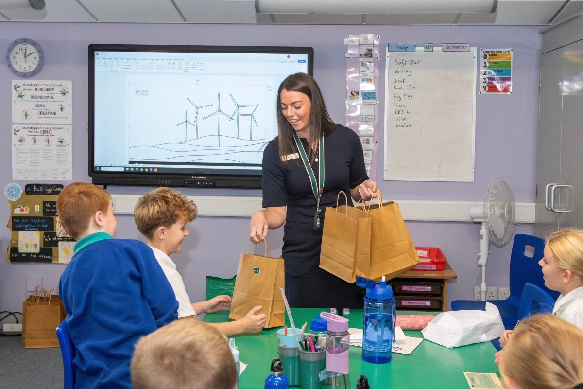 Hannah Williamson, The Cumberland’s Community Branch Manager – Gretna, Langholm & Lockerbie, with pupils from Eastrigg’s Primary School.