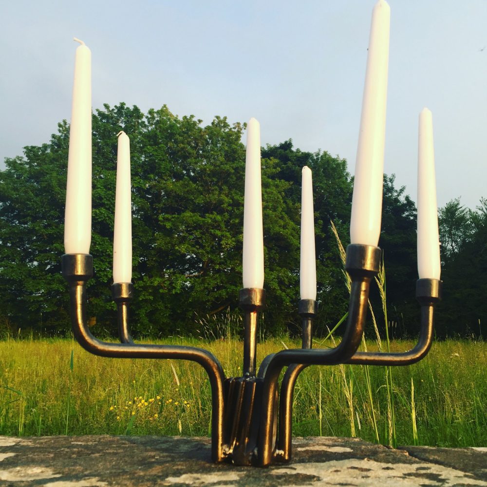 Candlestick made from wheel braces.